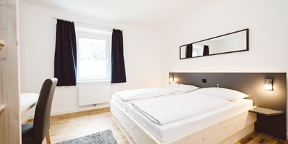 Hundehotel - Unterkunftsart: Appartement - Eisenerz - Schlafzimmer mit Doppelbett - Erzberg Alpin Resort