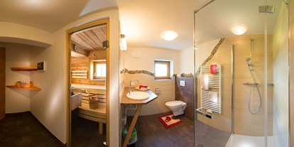 Hundehotel - Wäschewechsel - Badezimmer mit Sauna im Birnbaum Chalet Frauenkogel - Birnbaum Chalets