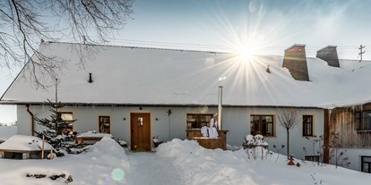 Hundehotel - Sitzplatz im Garten - Landhaus Chalet für 2 Personen
Terrasse im Winter - Das MUSSEA Landhaus Chalet & Scheunenloft